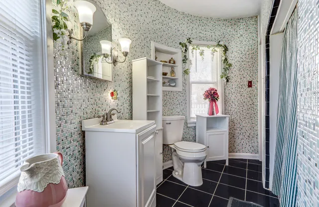 a very nice looking room with a large window and wooden floor