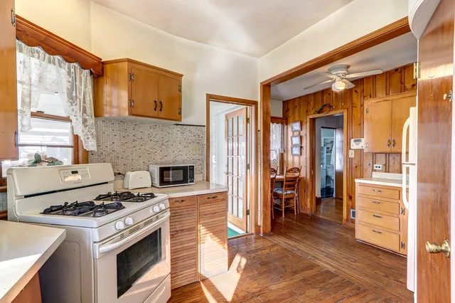 a kitchen with a stove and a refrigerator