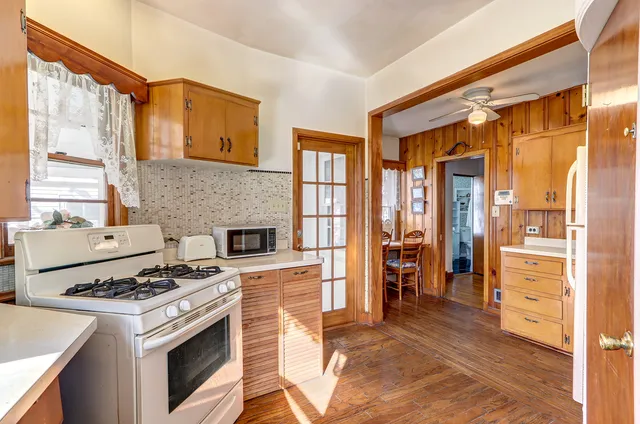 a kitchen with a stove a sink and a refrigerator