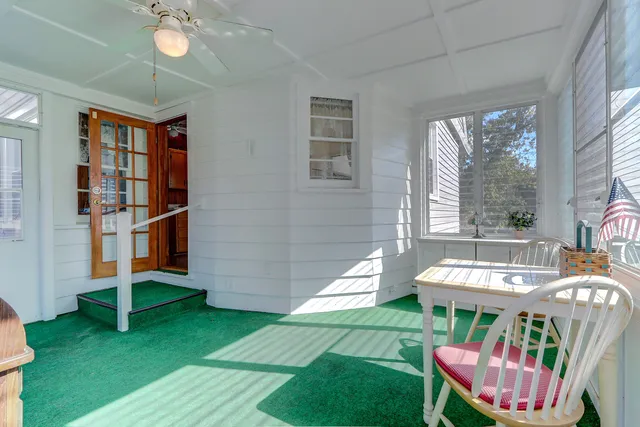 a bathroom with a sink mirror and toilet