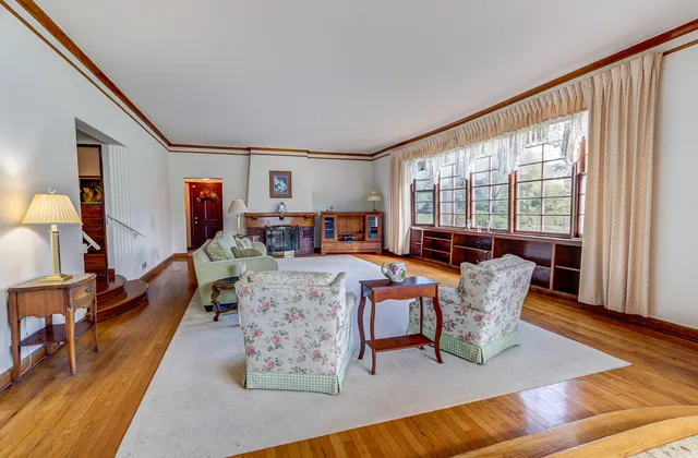 a dining room with furniture and window