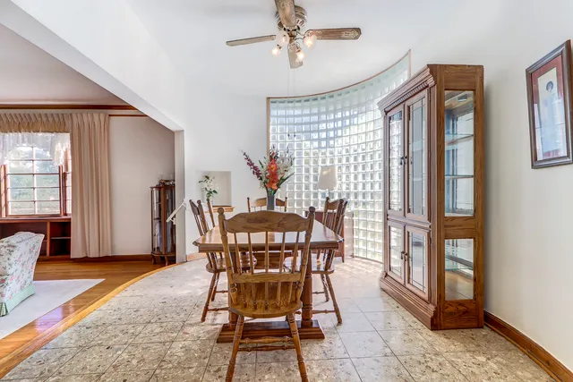 a dining room with furniture and wooden floor