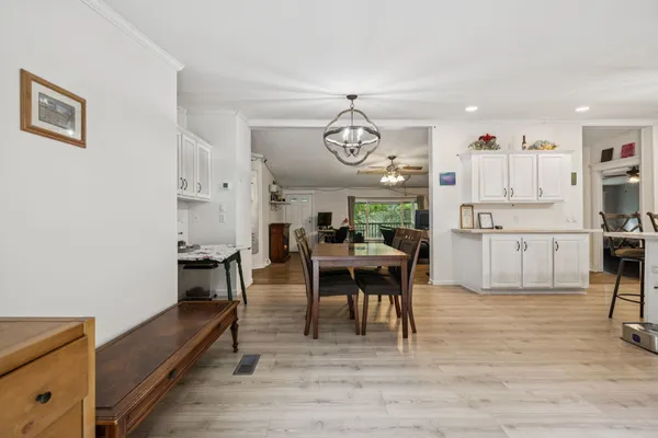 a view of kitchen with cabinets and wooden floor