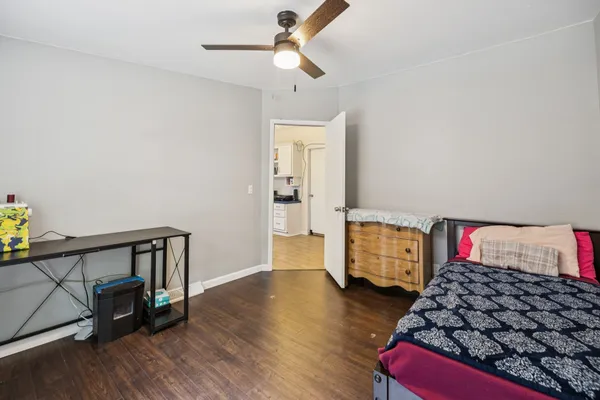 a bedroom with bed and cabinets