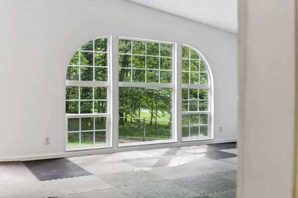 a view of a big room with a large window