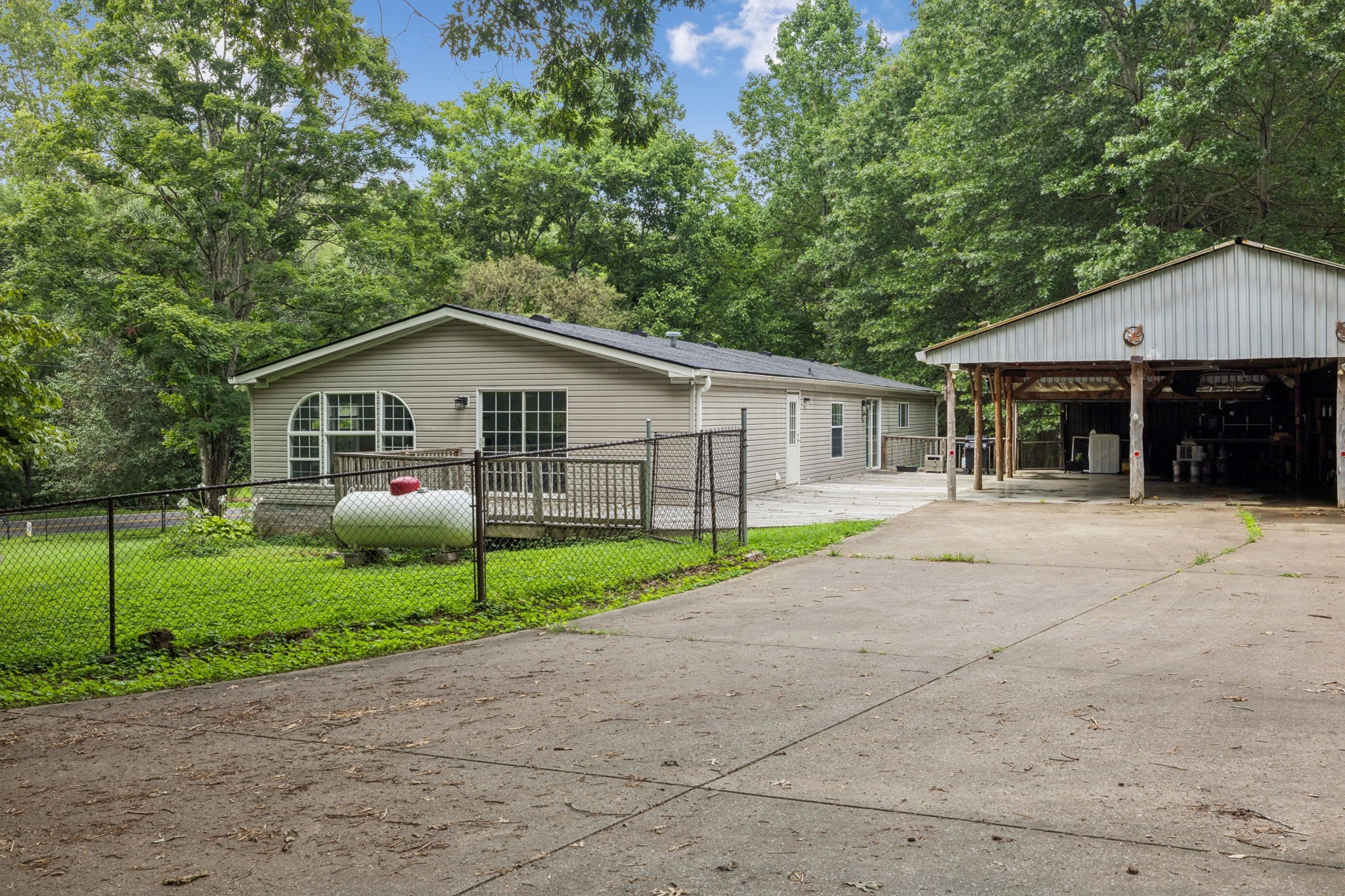 3063 Sweethome Road Chapmansboro, TN 37035 - Photo 45 of 46 a front view of a house with a yard and garage
