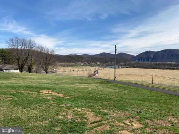 a view of a green field with outside view