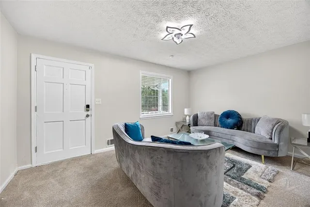 a living room with furniture and window