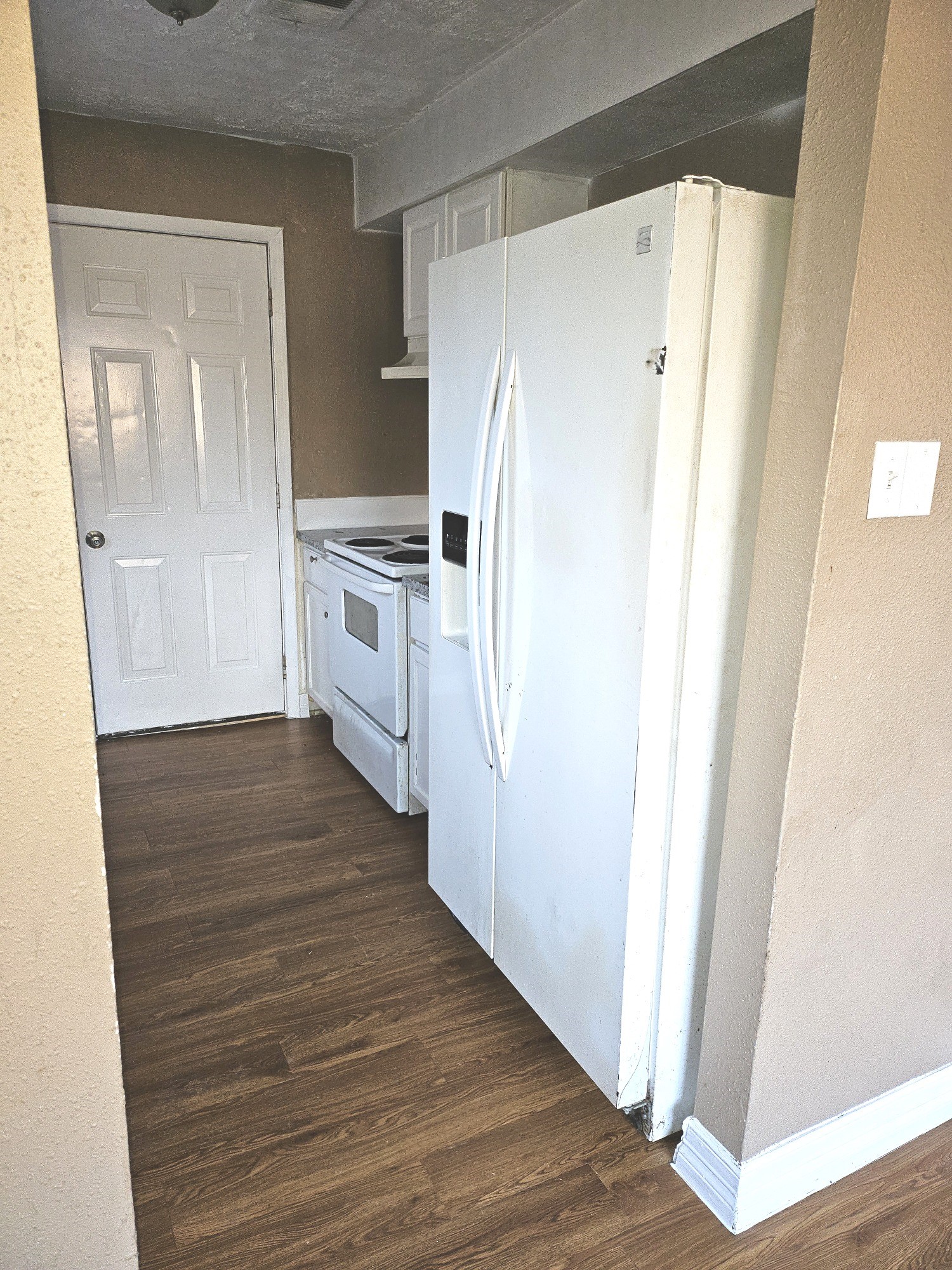 15829 Ridgeroe Lane Houston, TX 77053 - Photo 8 of 15 a kitchen with white cabinets and white appliances