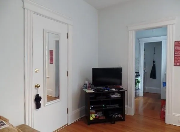a living room with furniture and flat screen tv