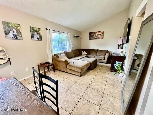 a kitchen with stainless steel appliances granite countertop a refrigerator a stove top oven a sink and dishwasher