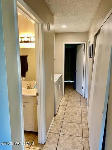 a bedroom with a bed and a large mirror