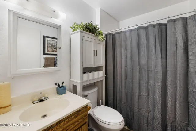 a bedroom with a bed and a television