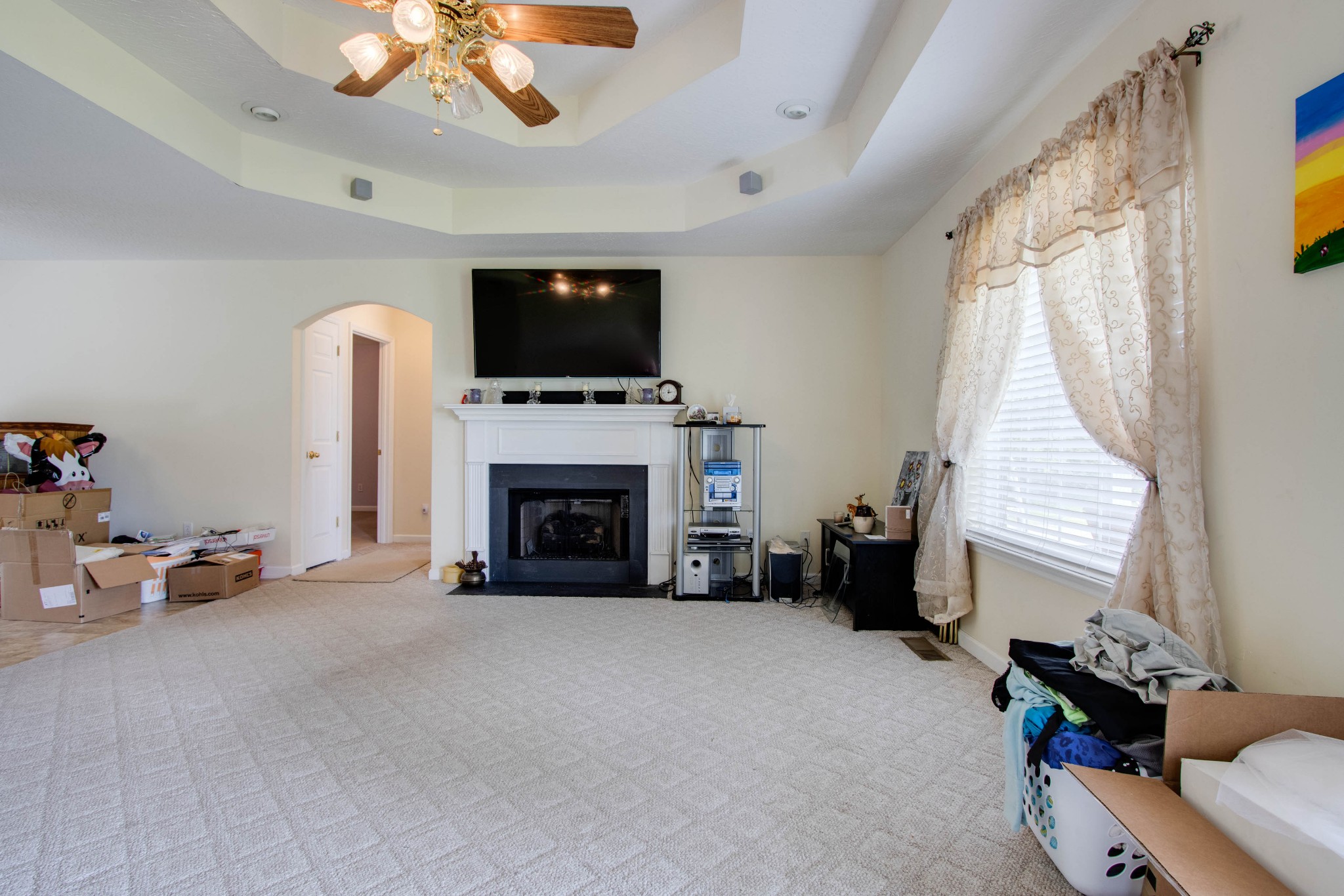 423 Ferguson Hill Road Lafayette, TN 37083 - Photo 13 of 63 a living room with furniture a fireplace and a flat screen tv