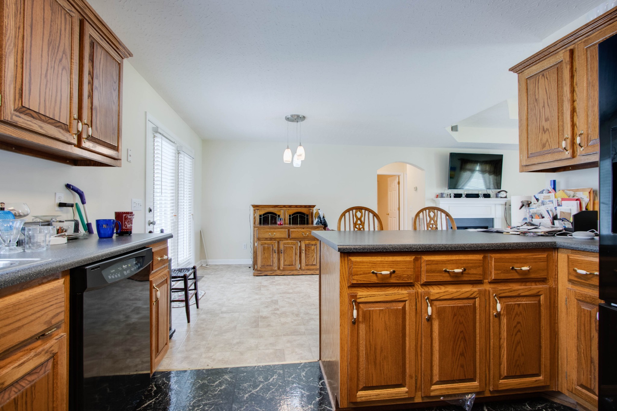 423 Ferguson Hill Road Lafayette, TN 37083 - Photo 25 of 63 a kitchen with stainless steel appliances granite countertop a sink stove and cabinets