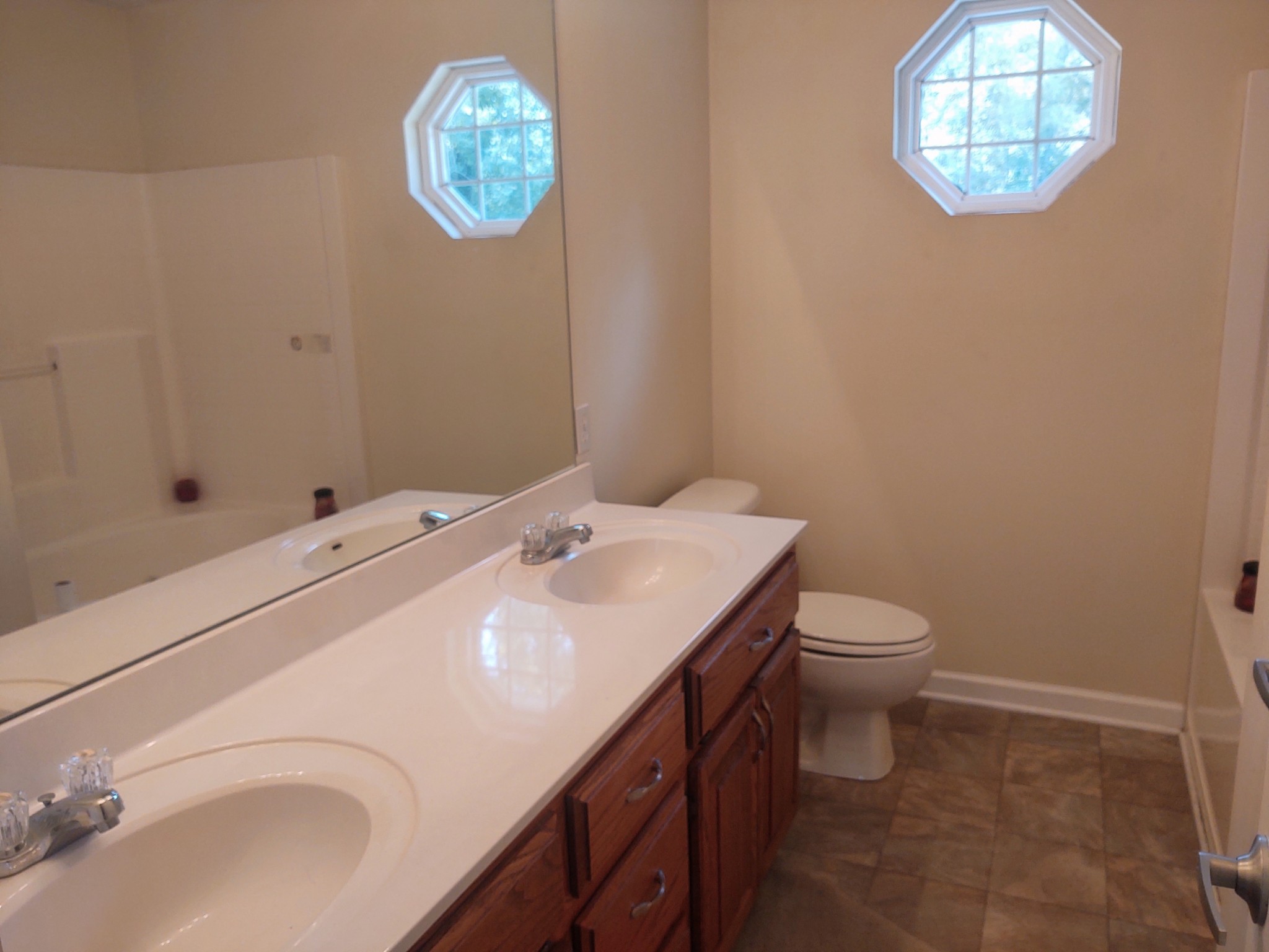 423 Ferguson Hill Road Lafayette, TN 37083 - Photo 33 of 63 a bathroom with a sink a toilet and a shower