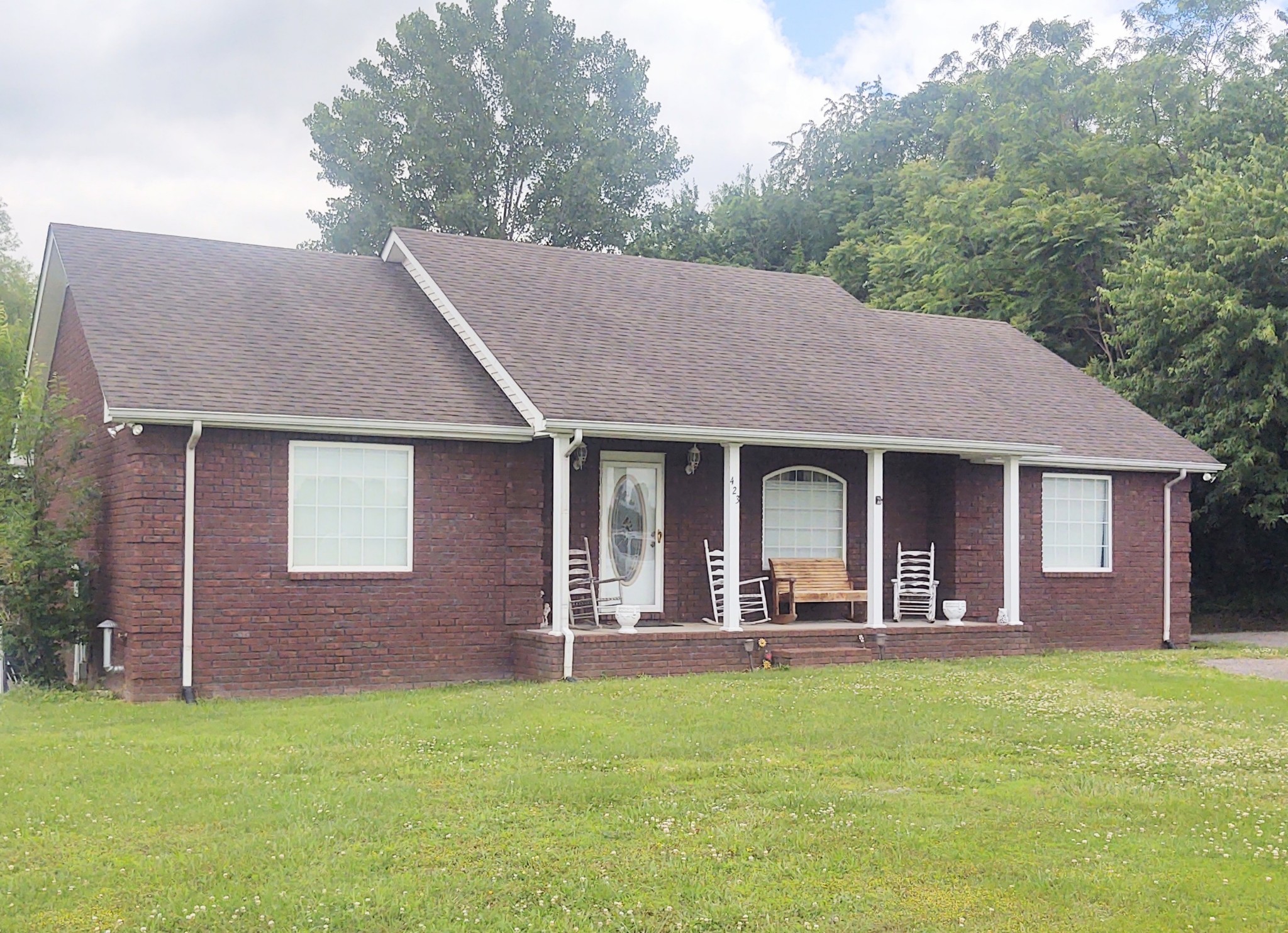 423 Ferguson Hill Road Lafayette, TN 37083 - Photo 4 of 63 a view of a house with a backyard