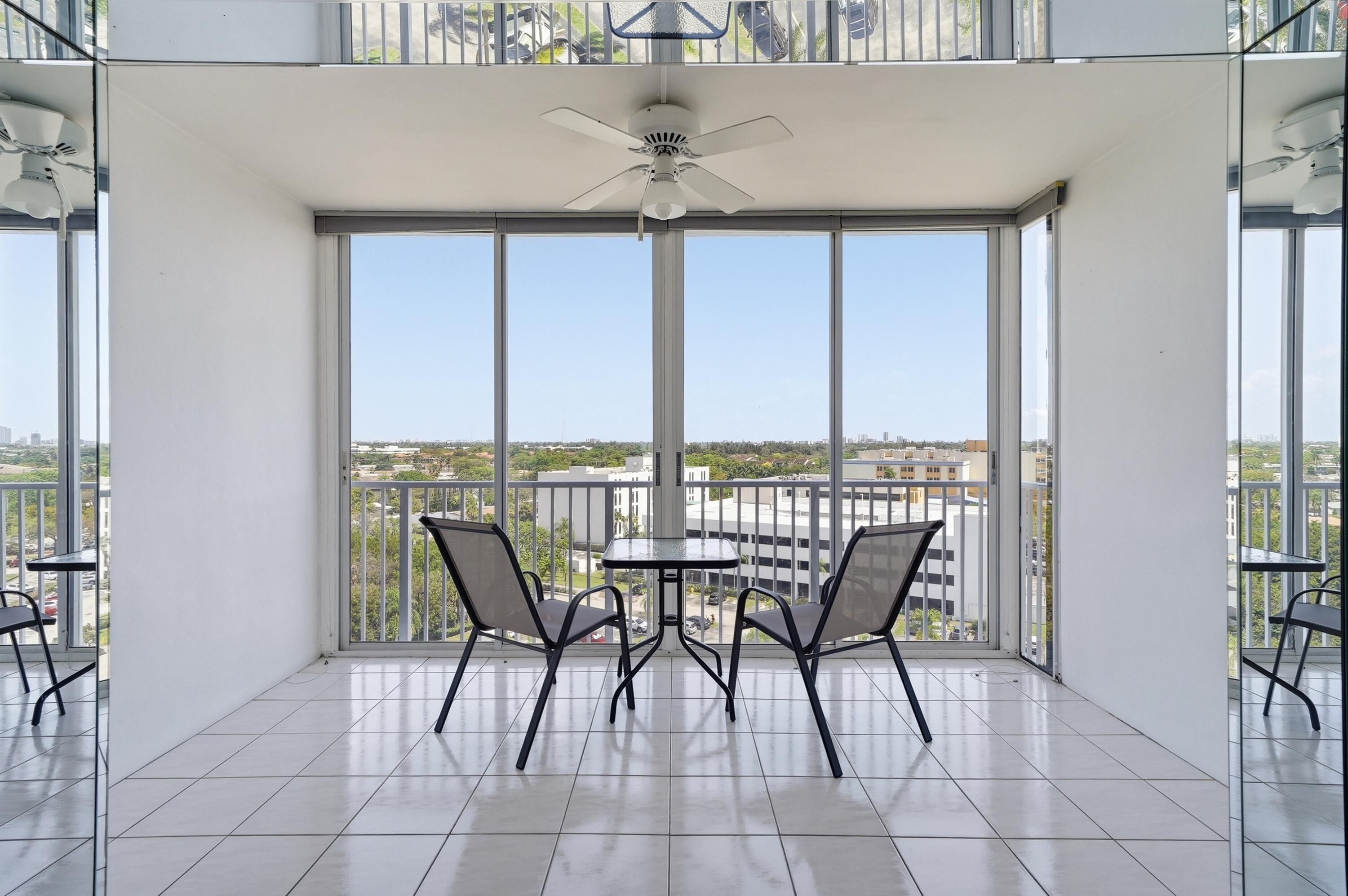 3850 Washington Street, Unit 1003 Hollywood, FL 33021 - Photo 17 of 30 a view of a dining room with furniture window and outside view