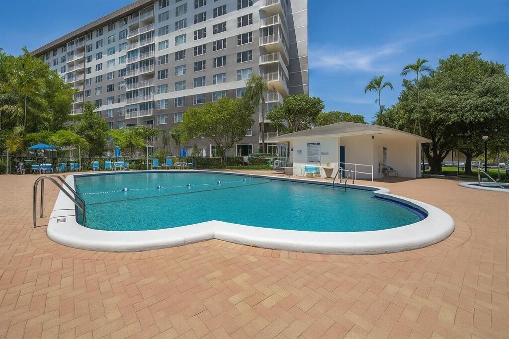 3850 Washington Street, Unit 1003 Hollywood, FL 33021 - Photo 2 of 30 a view of a swimming pool and outdoor space