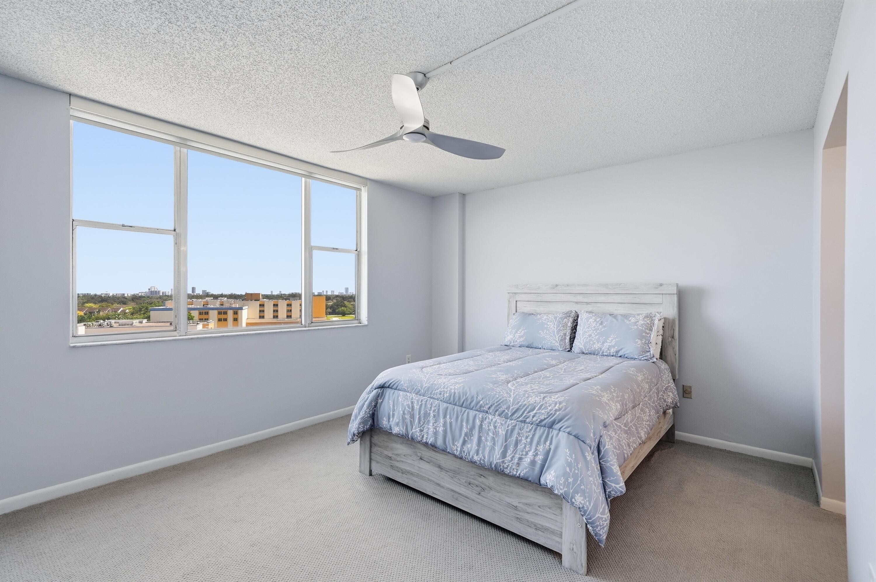 3850 Washington Street, Unit 1003 Hollywood, FL 33021 - Photo 21 of 30 a bedroom with a bed and a window