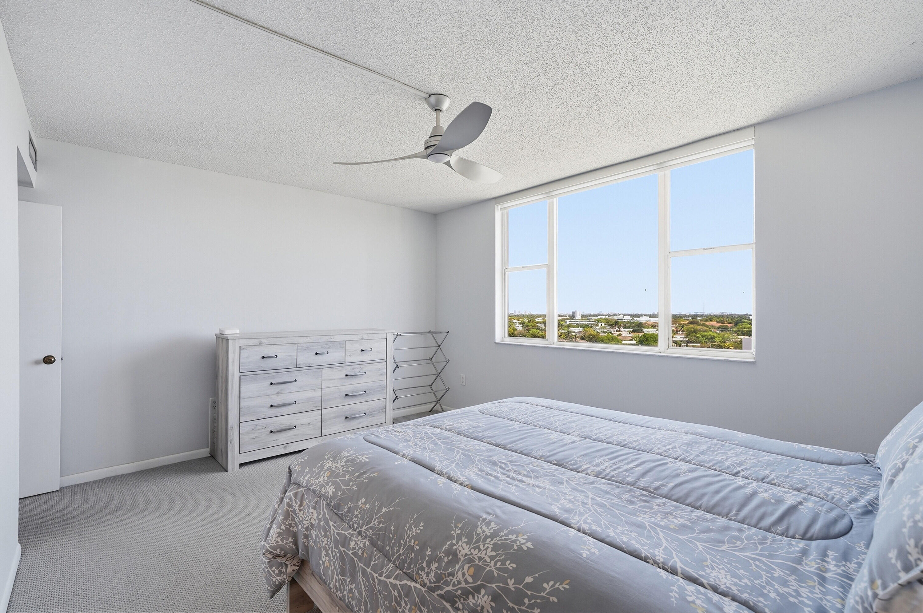 3850 Washington Street, Unit 1003 Hollywood, FL 33021 - Photo 22 of 30 a bedroom with a bed and a window