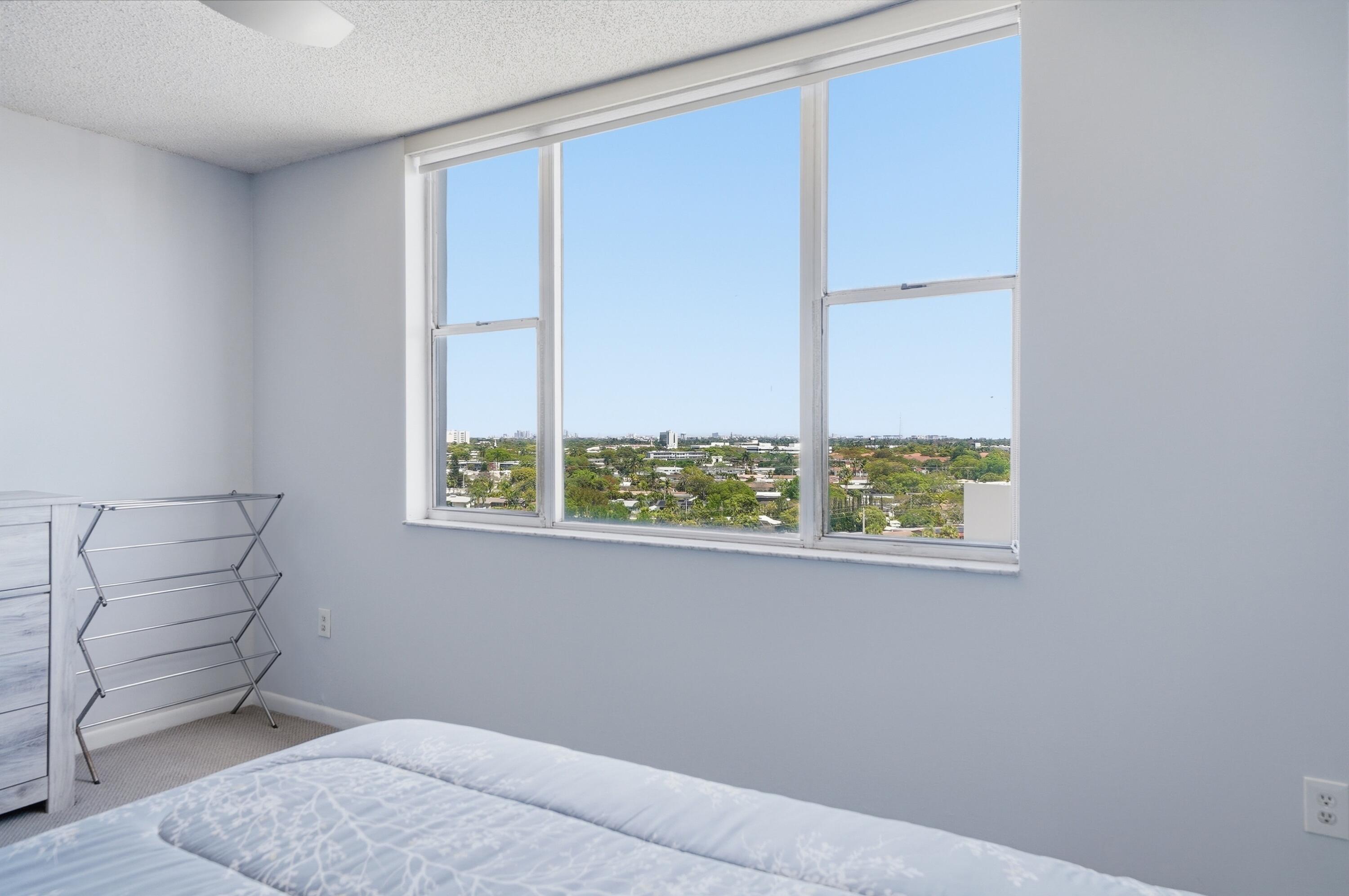 3850 Washington Street, Unit 1003 Hollywood, FL 33021 - Photo 27 of 30 a bedroom with a bed and a window