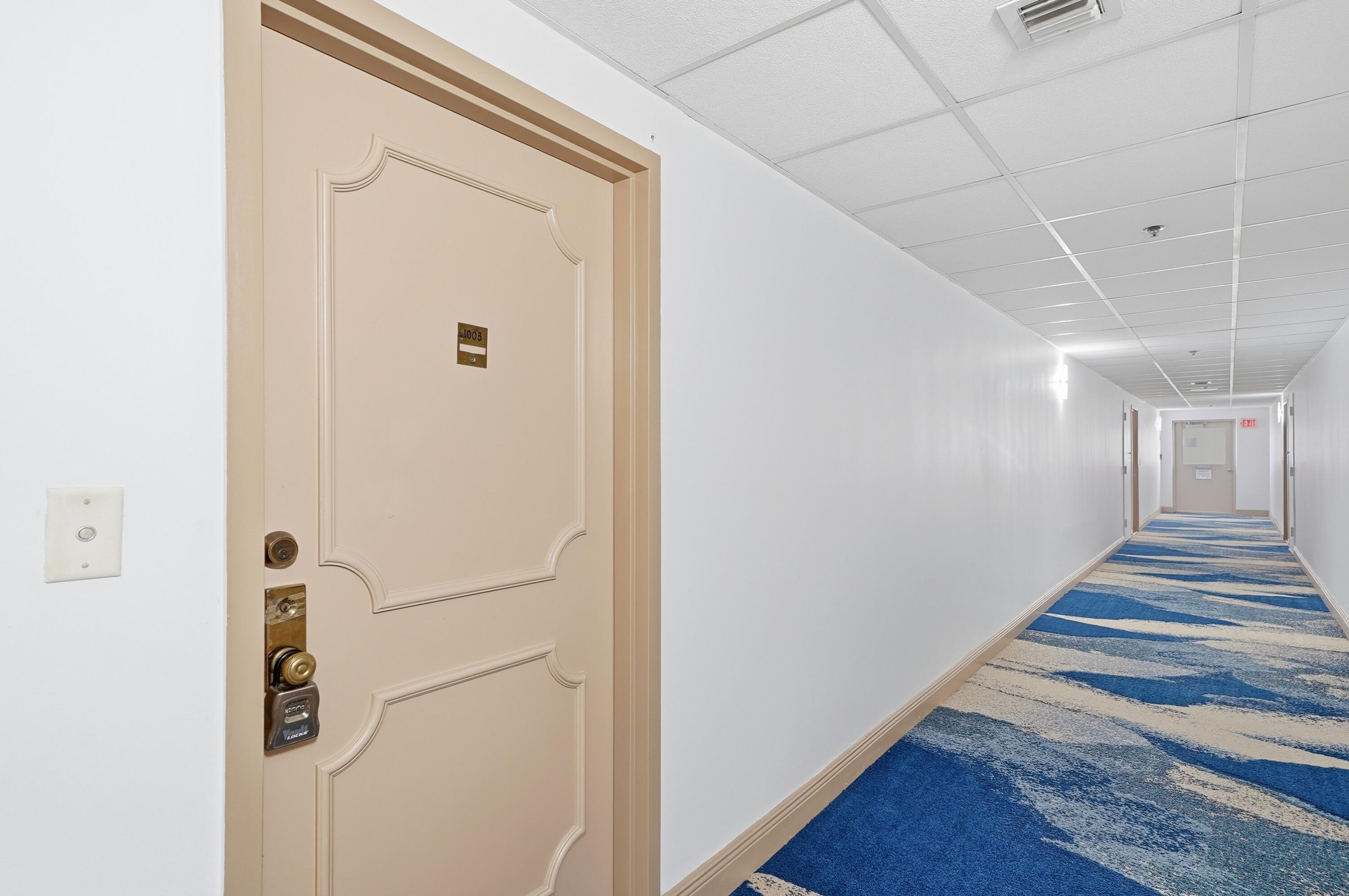 3850 Washington Street, Unit 1003 Hollywood, FL 33021 - Photo 4 of 30 a view of a hallway with wooden floor