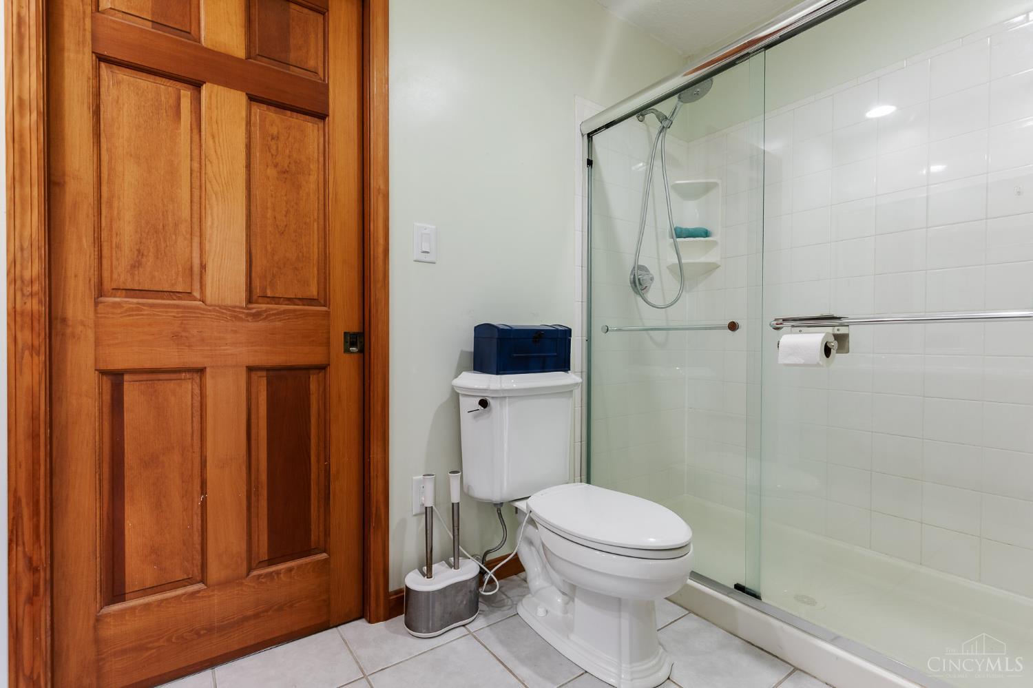 623 Ibold Road Loveland, OH 45140 - Photo 24 of 35 Connecting the home's two secondary bedrooms, the Jack & Jill bath offers a generous dual-sink vanity, shower with glass enclosure, and a practical layout designed for everyday convenience.