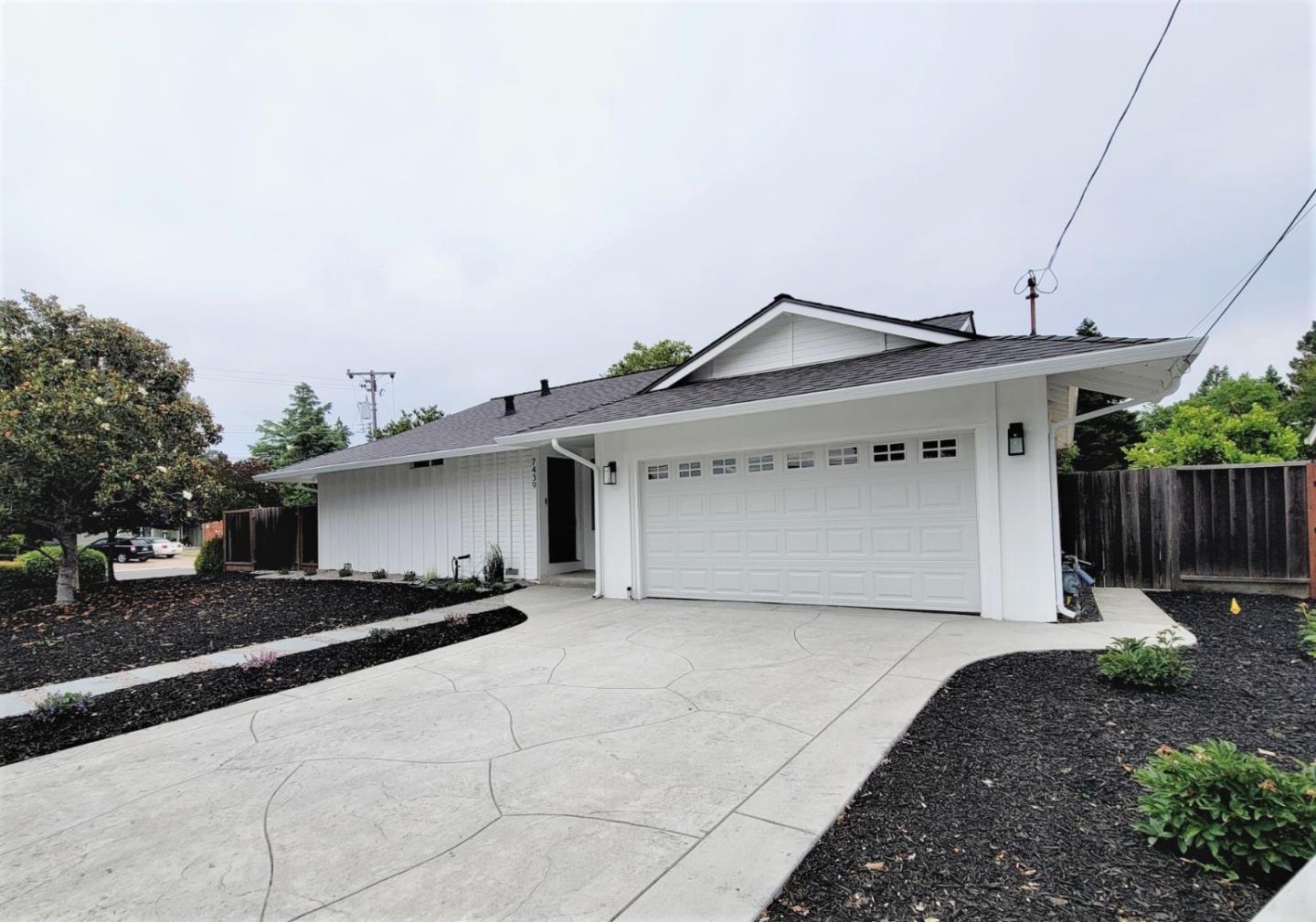 7439 Blue Fox Way San Ramon, CA 94583 - Photo 1 of 19 a front view of a house with a yard