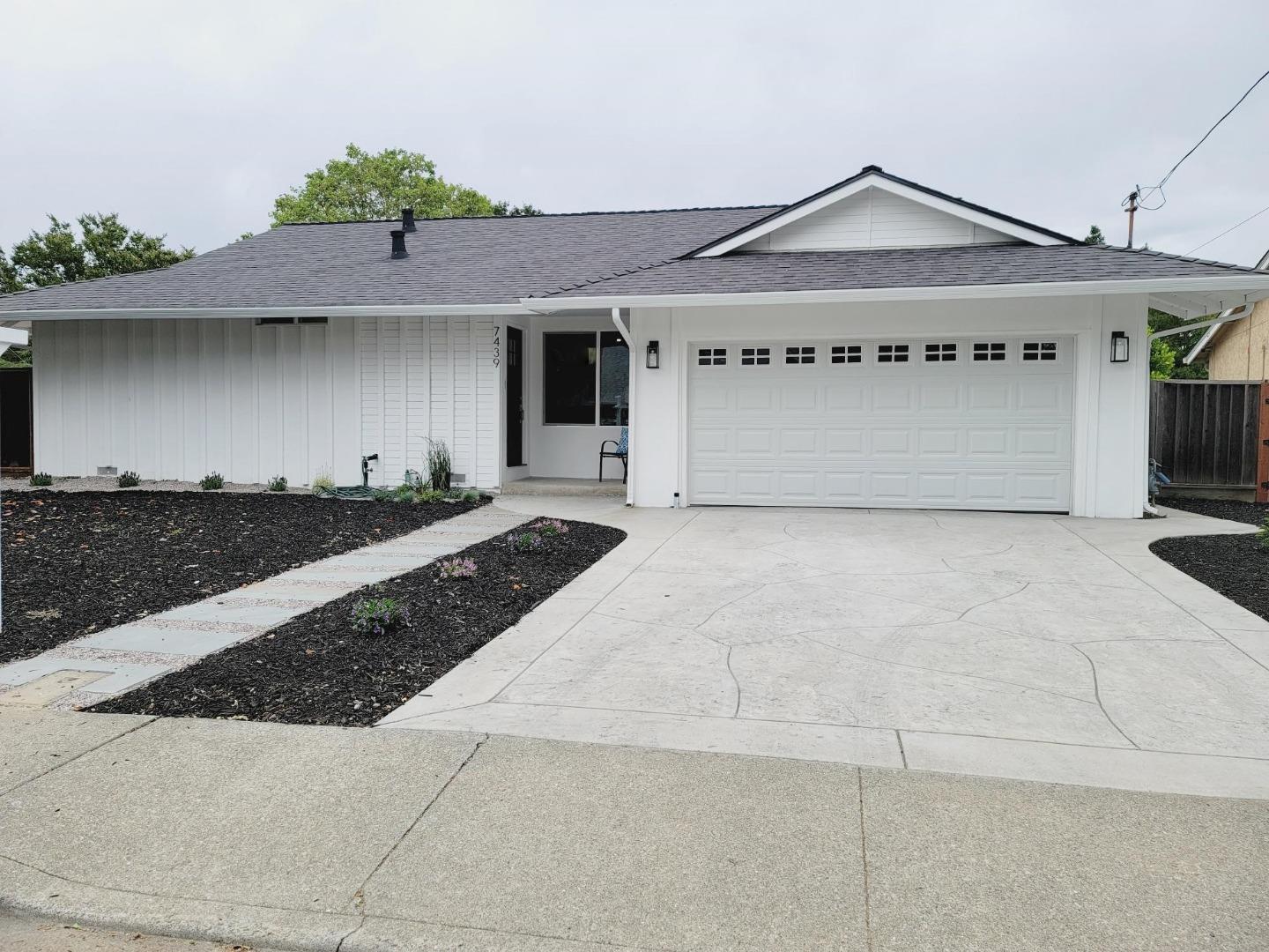 7439 Blue Fox Way San Ramon, CA 94583 - Photo 2 of 19 a front view of a house with a garage