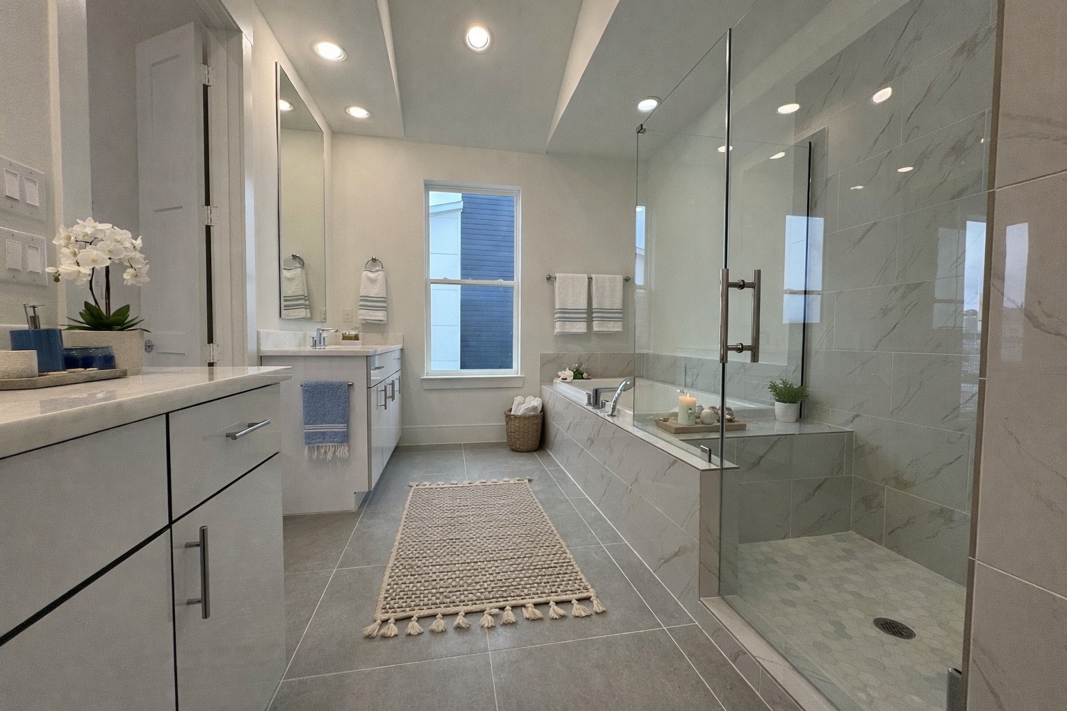 9807 Hope Harbor Lane Houston, TX 77080 - Photo 5 of 11 Spacious primary bath with a 6' soaker tub and a separate glass shower. Virtual staging added.