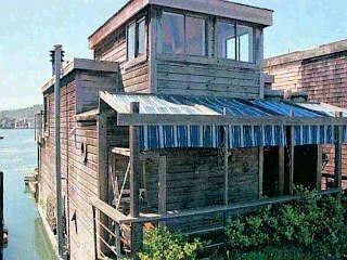 a view of a house with wooden fence