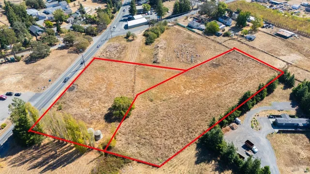 a view of swimming pool with a patio and wooden bench