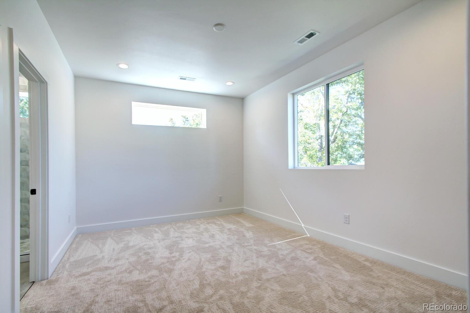 4128 Chase Street Denver, CO 80212 - Photo 19 of 42 an empty room with windows
