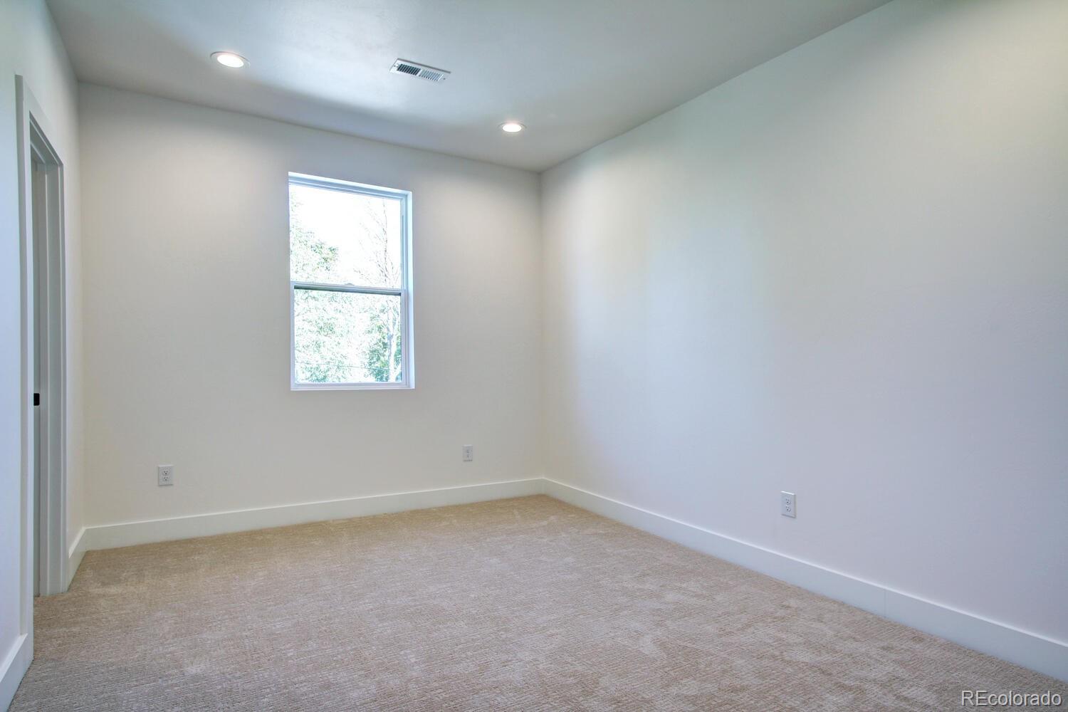 4128 Chase Street Denver, CO 80212 - Photo 24 of 42 an empty room with windows