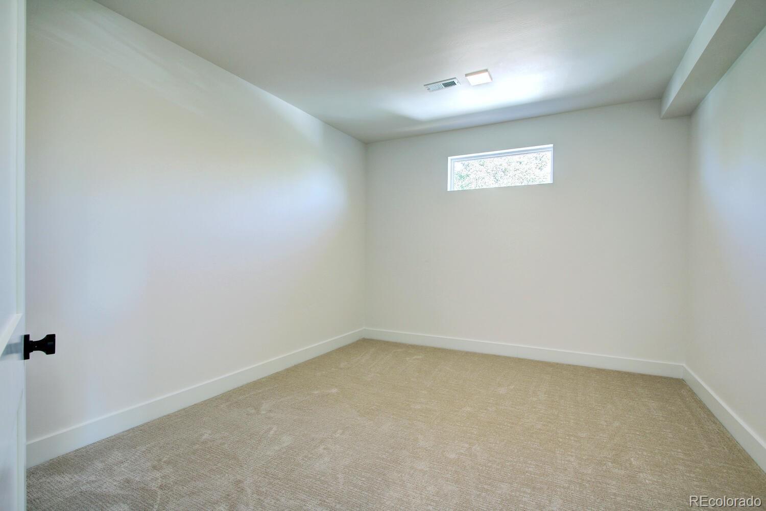 4128 Chase Street Denver, CO 80212 - Photo 28 of 42 an empty room with a window