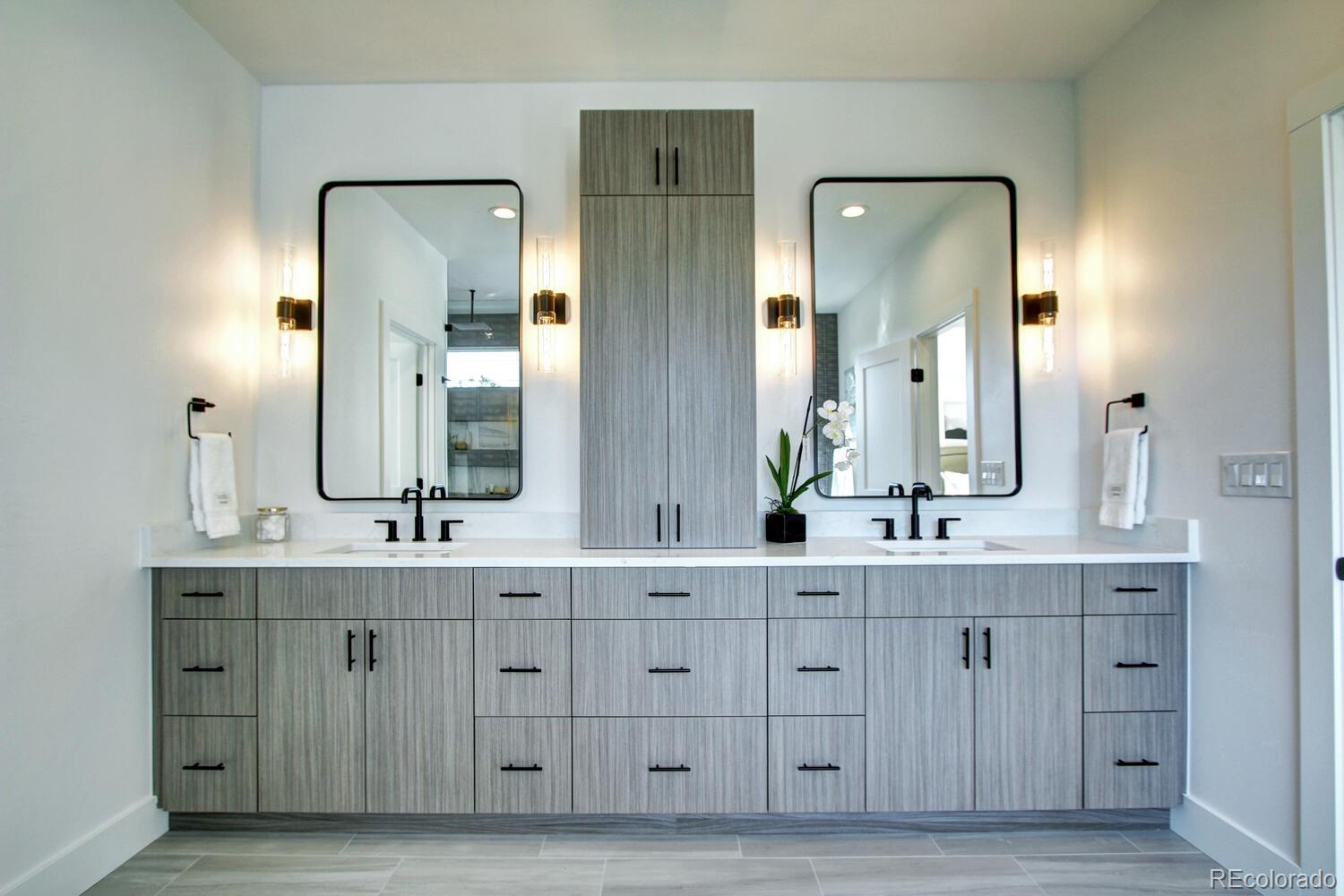 4128 Chase Street Denver, CO 80212 - Photo 30 of 42 a bathroom with a double vanity sink and mirror