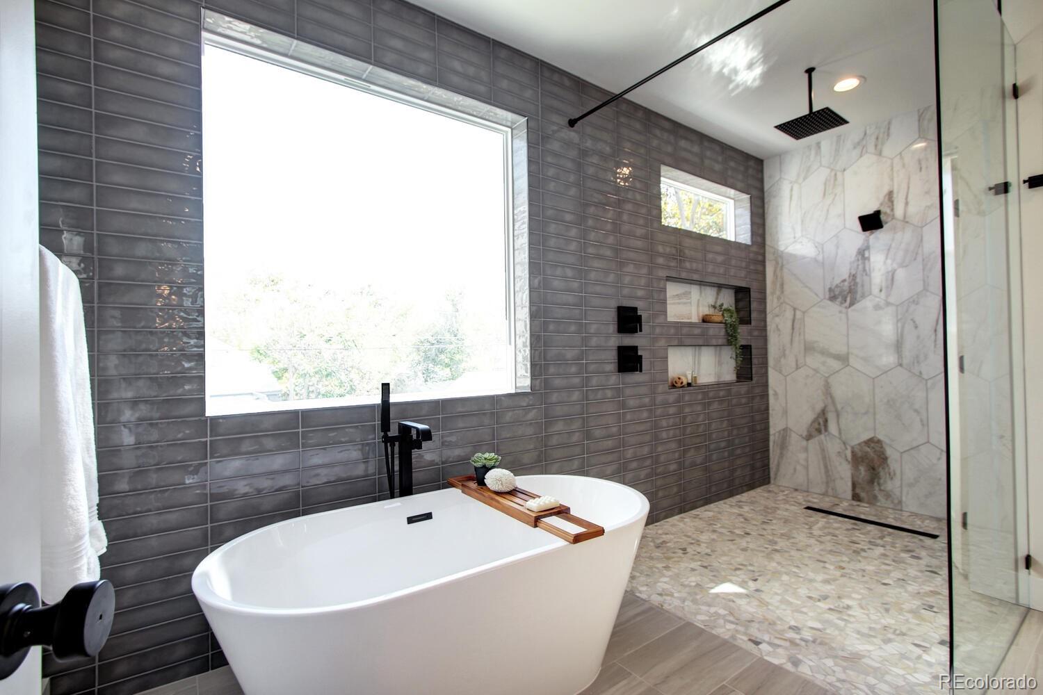 4128 Chase Street Denver, CO 80212 - Photo 32 of 42 a bathroom with a sink and a bathtub