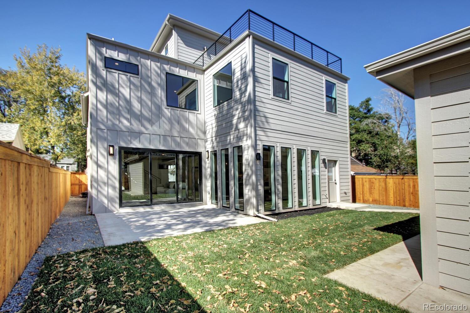4128 Chase Street Denver, CO 80212 - Photo 40 of 42 a front view of a house with garden