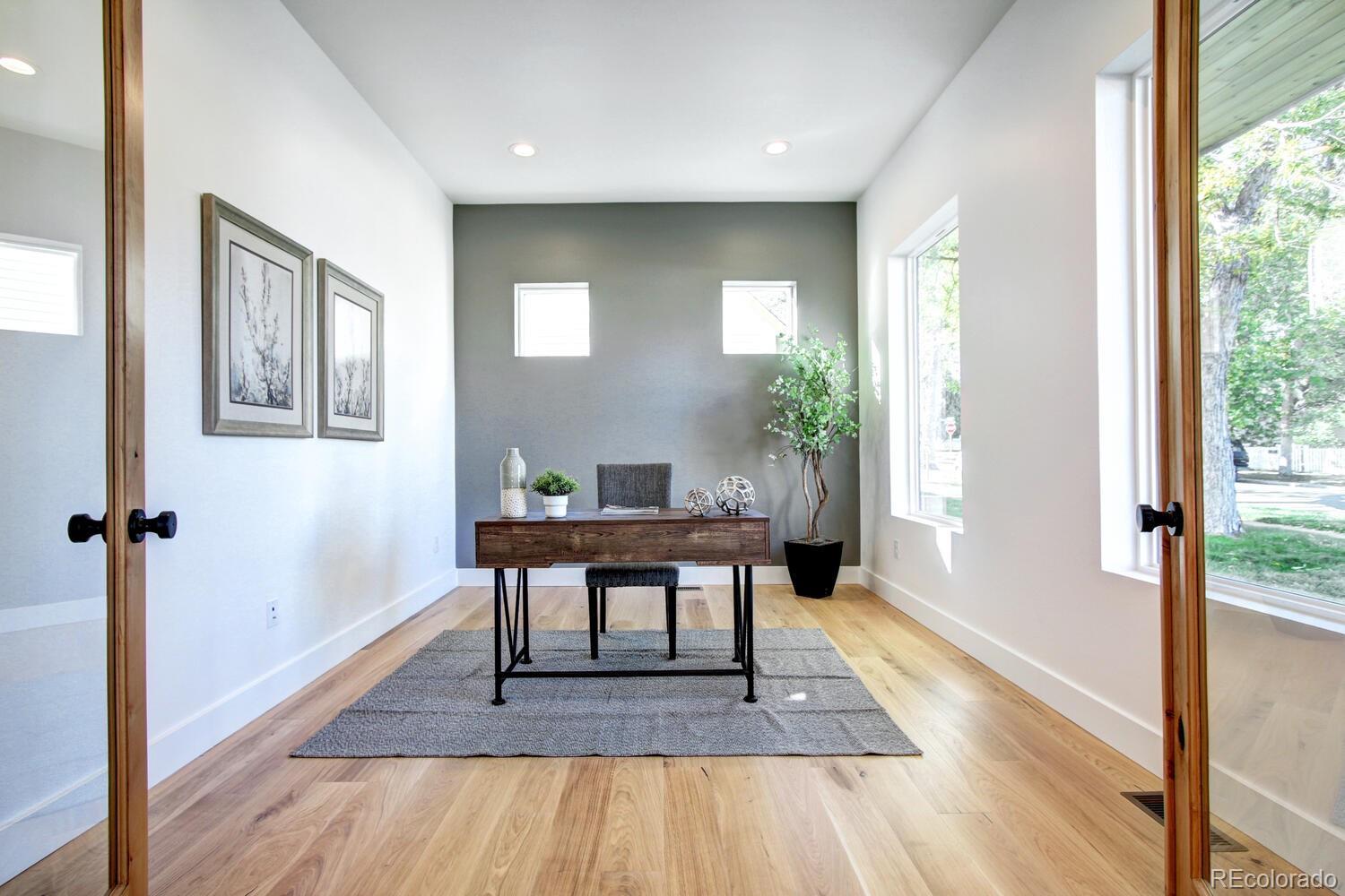 4128 Chase Street Denver, CO 80212 - Photo 6 of 42 a view of a livingroom with furniture window and wooden floor