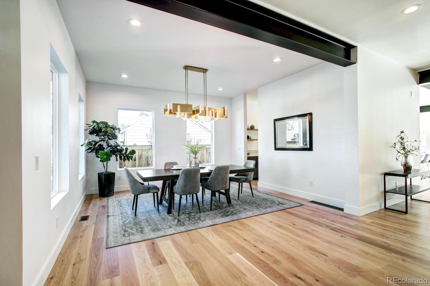 4128 Chase Street Denver, CO 80212 - Photo 7 of 42 a view of a dining room with furniture and wooden floor