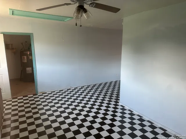 a room with a black white checkered floor with a black white checkered floor