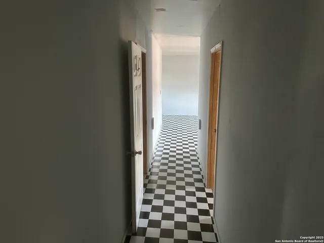 a view of a balcony with wooden floor