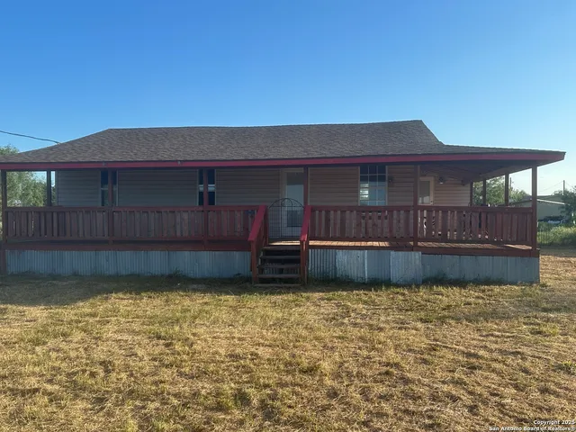 a view of a house with a big yard