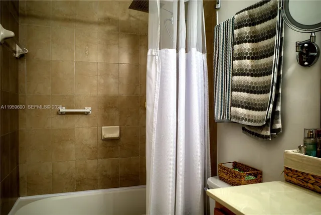 a bedroom with bed and a window