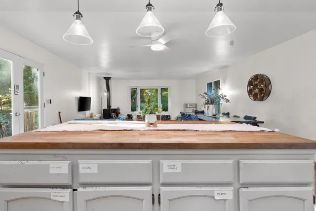 a view of living room with granite countertop furniture and a large window