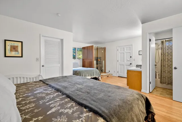 a kitchen with a refrigerator and a stove top oven