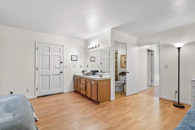 a bedroom with a bed and a window