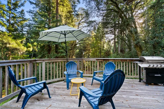 a view of balcony with wooden floor and outdoor seating