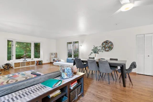 a view of a dining room with furniture window and outside view